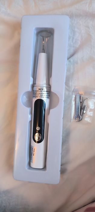 Уред за ултразвуково почистване на зъби