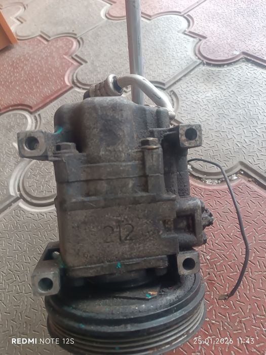 Компрессор кондиционера Мазда 323