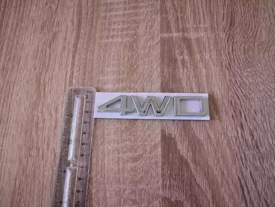 сребриста емблема Kia 4WD