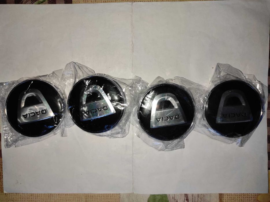 Set 4 Capace Dacia 60mm negre pentru jante aliaj