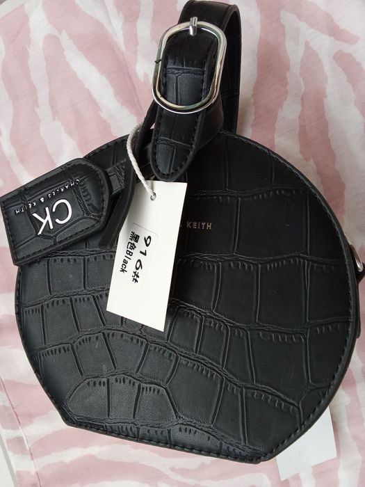 Круглая новая сумка