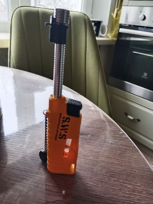 Зажигалка с выдвижным носом .