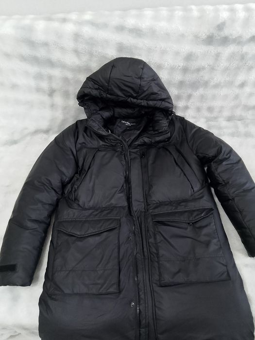 Продам пуховик, размер на 58.