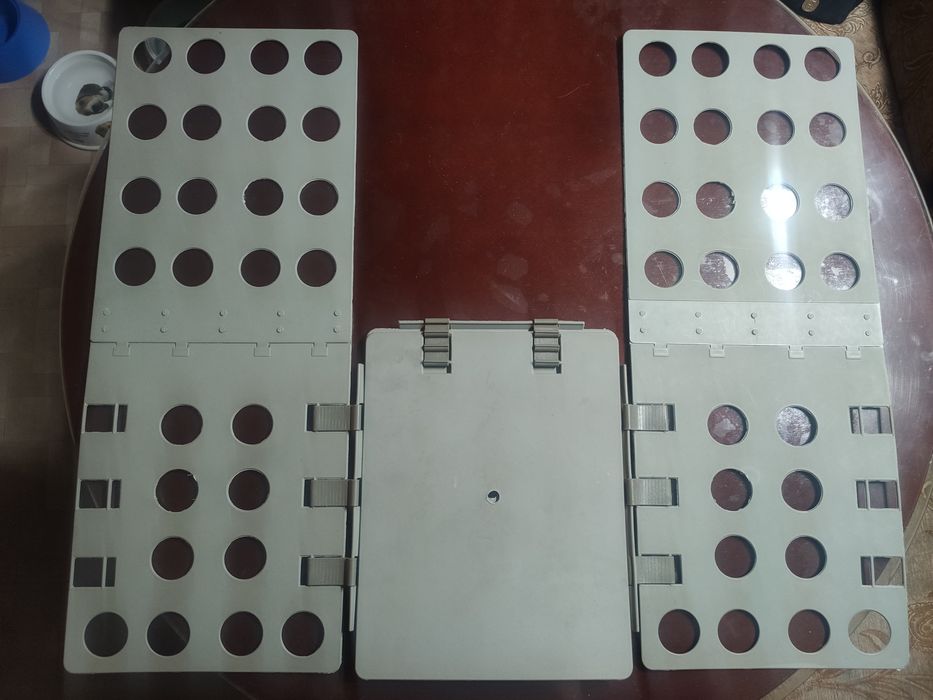 Приспособление для складывания одежды