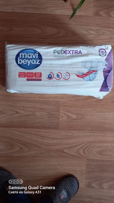Памперсы в упаковке  . .