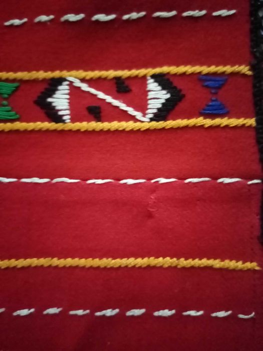 Женска народна носия-престилка и пищимал.