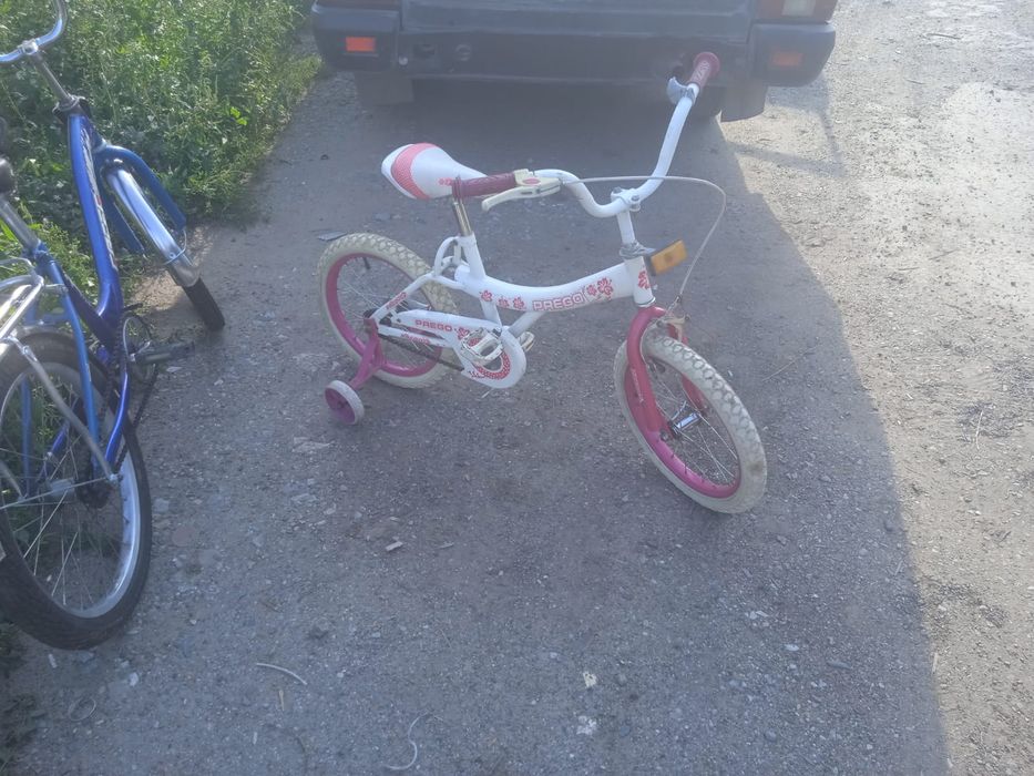 Велосипед с поддерживающими колесиками