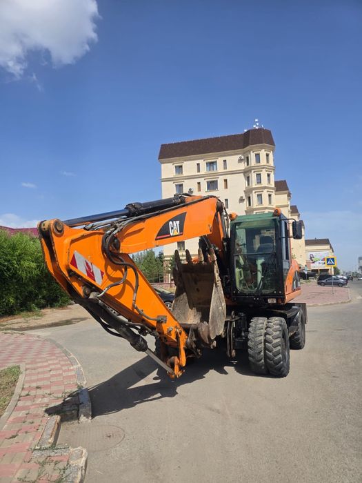 Продаётся колесный экскаватор CAT