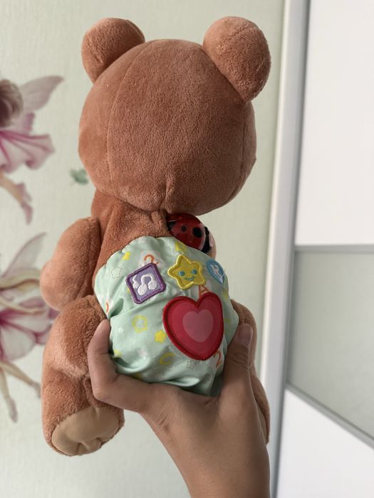 Продам игрушку ползающий мишка