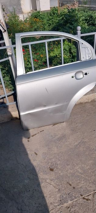 Эшик Нексия 3 чап томон орка.Колпак хам бор оригинал.