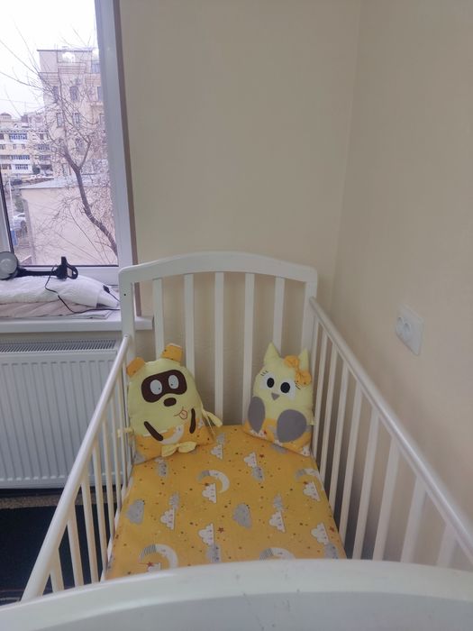 Детская кроватка с маятником Российская