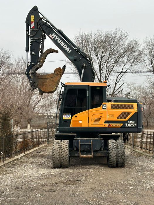 Услуги аренда колесный экскаватор
