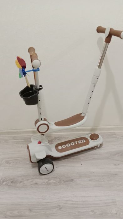 Самокат с ручкой и сиденье 5тыс