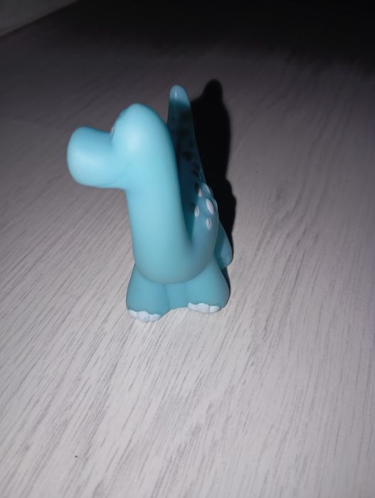 Игрушка динозавр синий