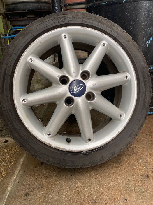 Jante originale Ford 16" 4x108 (8 spițe) + Anvelope Taurus 195/45 R16 (DOT 2025 / 2021)