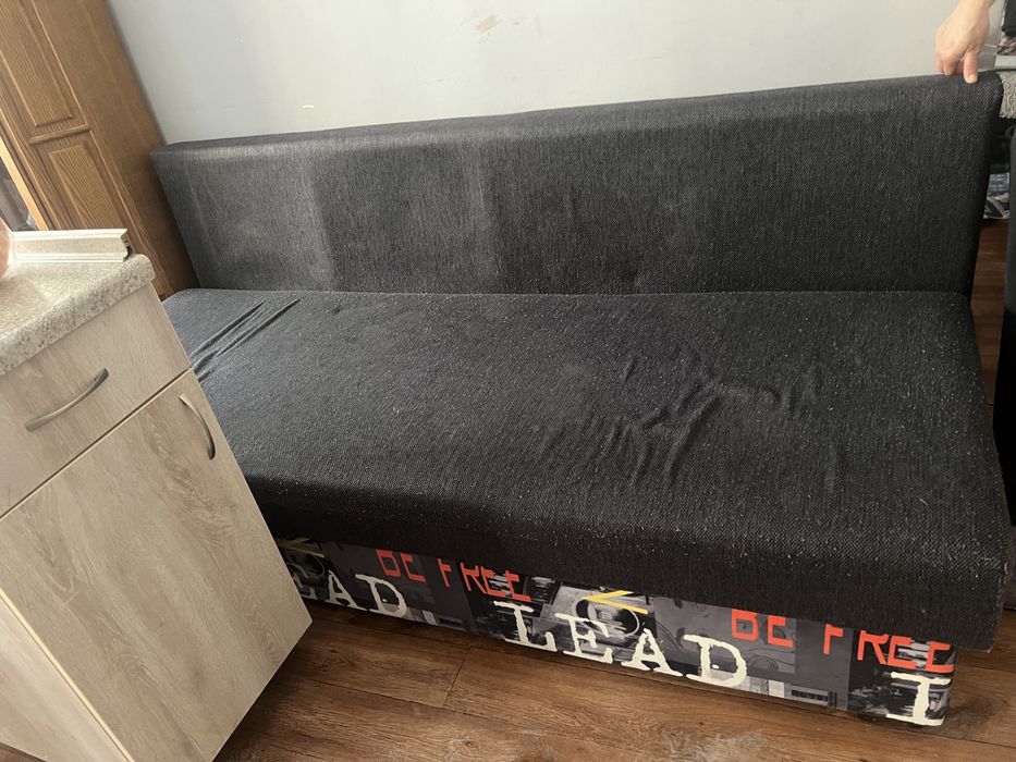 Продам диван раскладной б/у серого цвета .