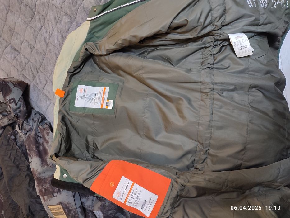 Продам пуховик 52-54 размер