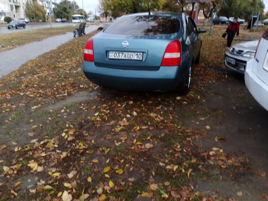 Ниссан п12 2002 год