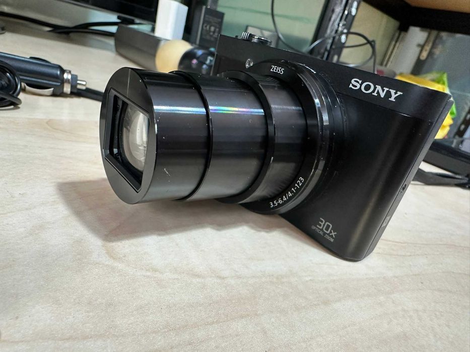 sony dsc-wx500 de culoare negru mat fata spate lateral unghi deschis
