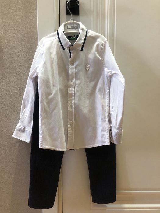 Продам рубашки,брюки и шорты