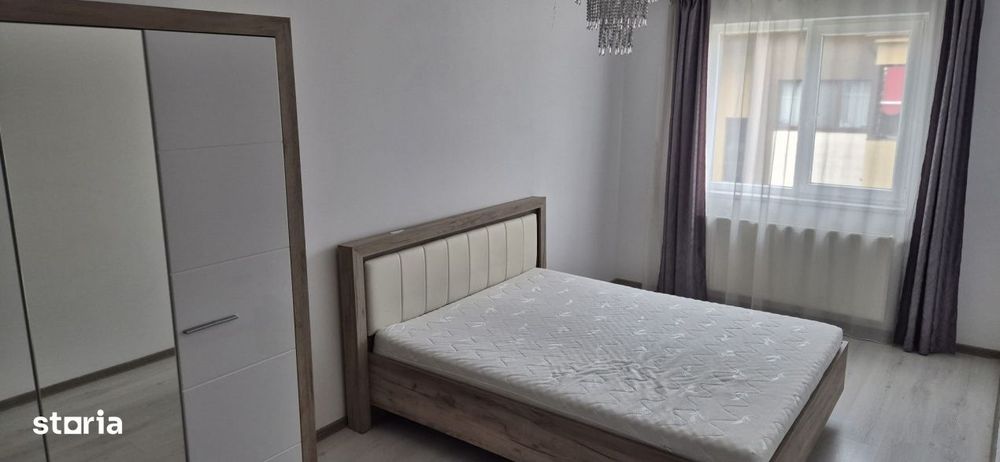 Apartament cu doua dormitoare, parcare proprie, mobilat si utliat