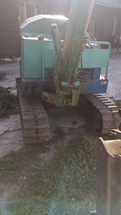 Японский миниэкскаватор Takeuchi TB