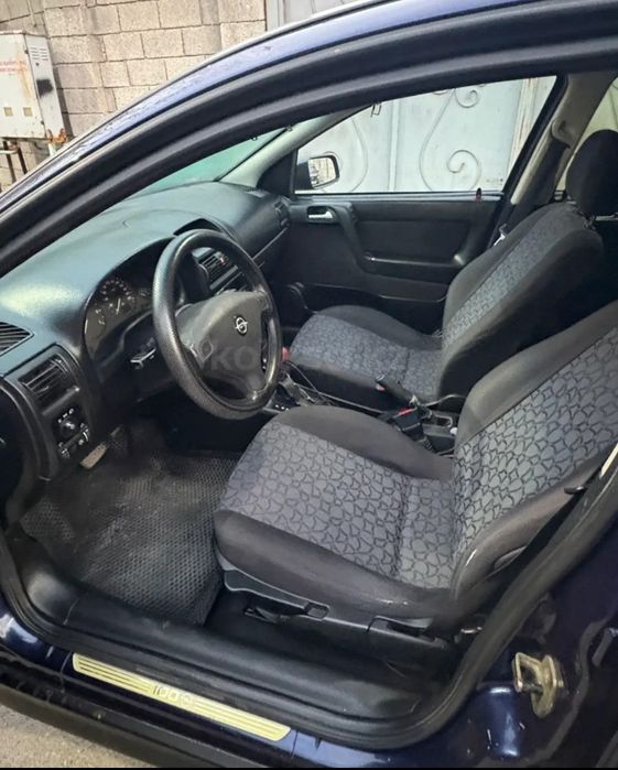 Опель астра машина