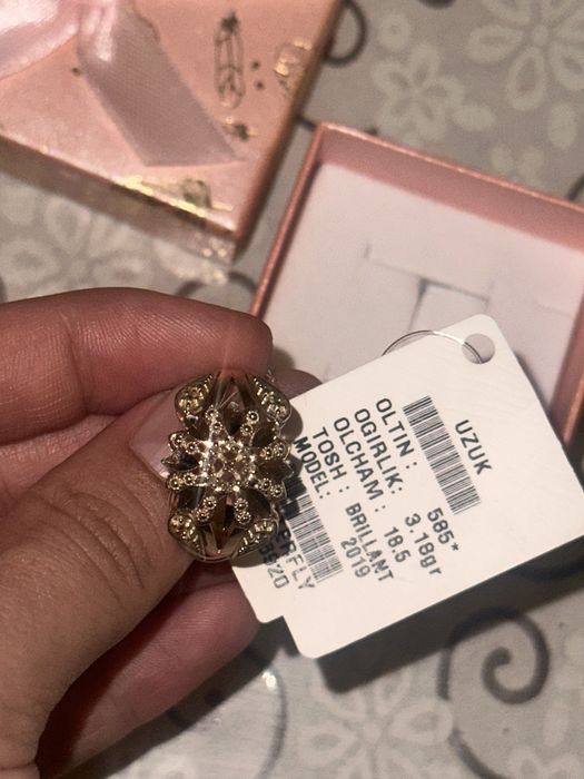 Tilla uzuk brilliant toshli 3,18 grammli 585 proba