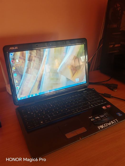 Laptop ASUS AMD Athlon Dual Core - Funcțional, cu cablu alimentare