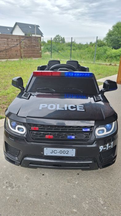 Masinuta de politie cu girofar NOVOKIDS 2-7 ani, cu telecomanda,USB,muzica, 2 motoare