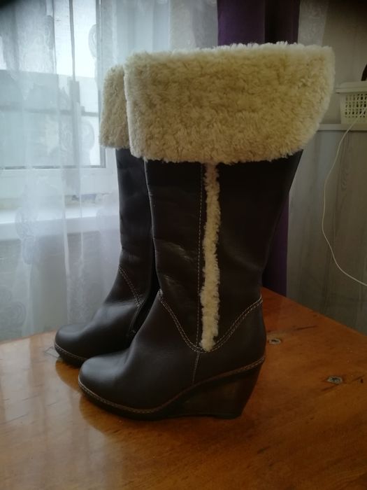 Новые кожаные сапоги