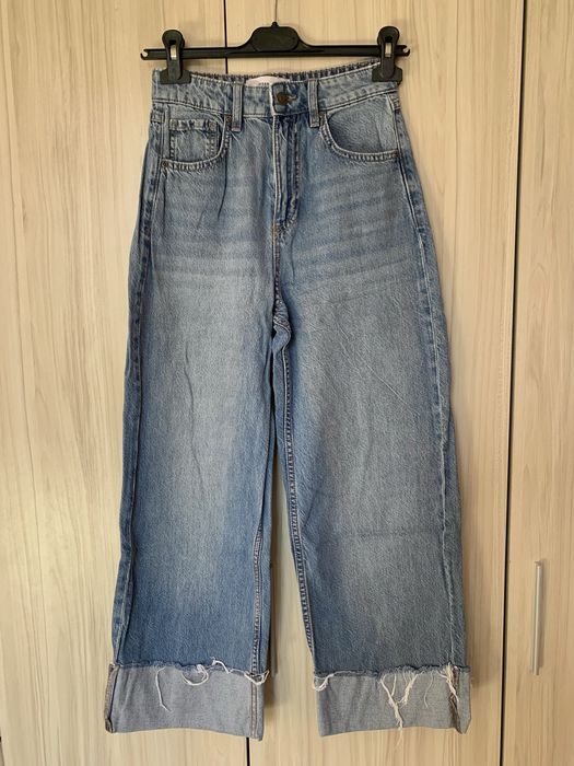 Дънки с подгънати широки крачоли