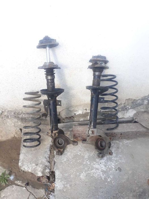Форд эскорт .Стойки ,пружина