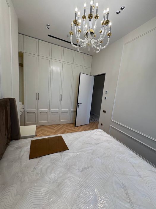 NestOne квартира 23 этаж 59м Блок А. Балкон в Ташсити парк смотрит