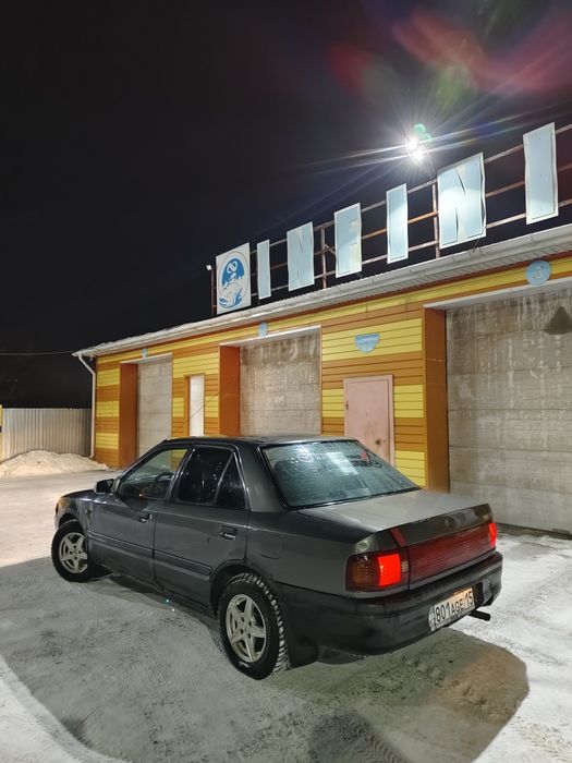 Машина мазда 323