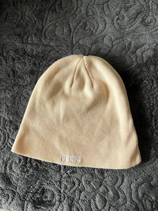 Шапка на puma , цвета е светло розов