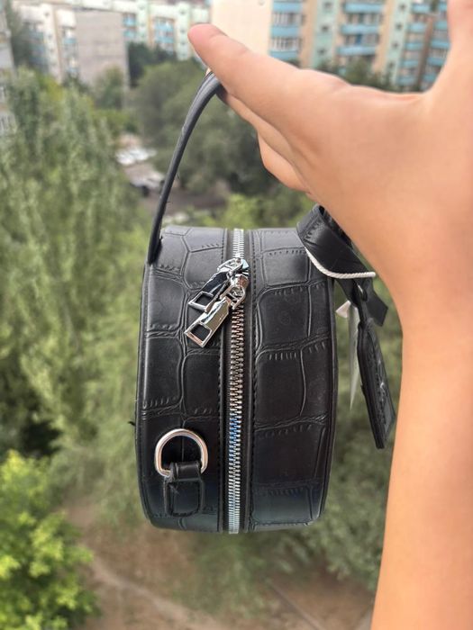 Круглая новая сумка