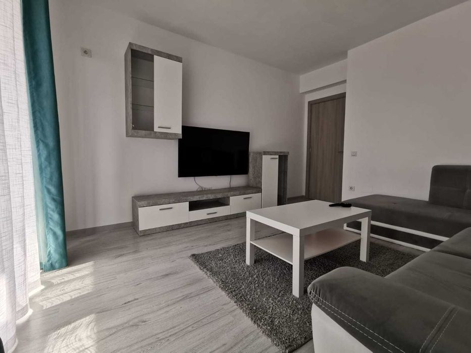 Apartament doua camere cu loc de parcare si curte proprii
