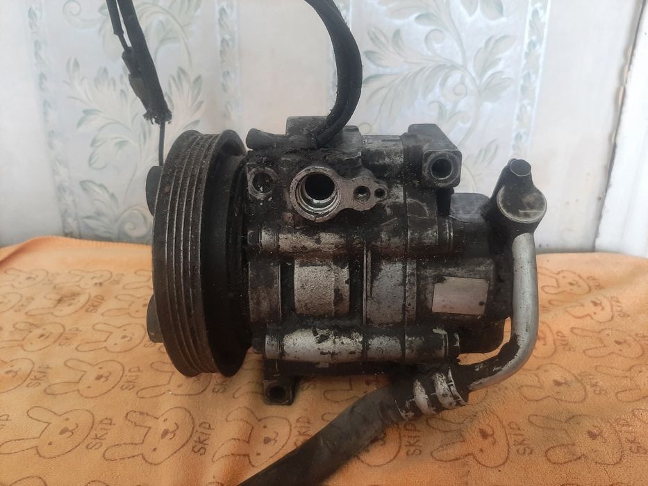 Компрессор кондиционера на Мазду