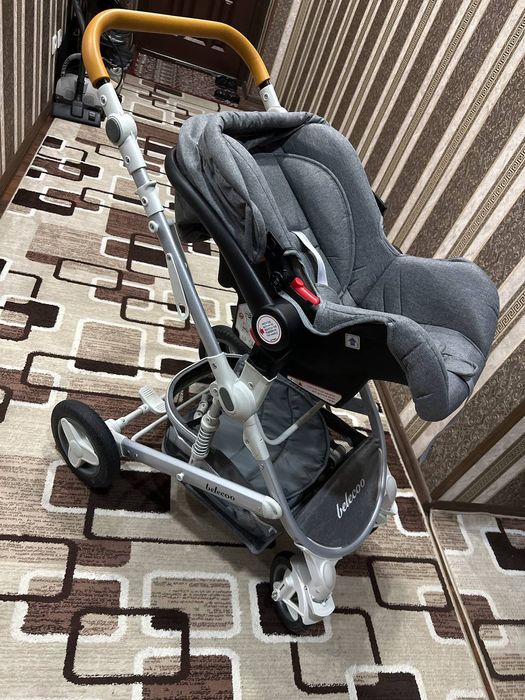 Kolaska va ovqat yidgan stul