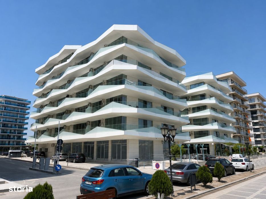 Apartament cu vedere la mare in imobil futurist pe plaja — fotografia 1