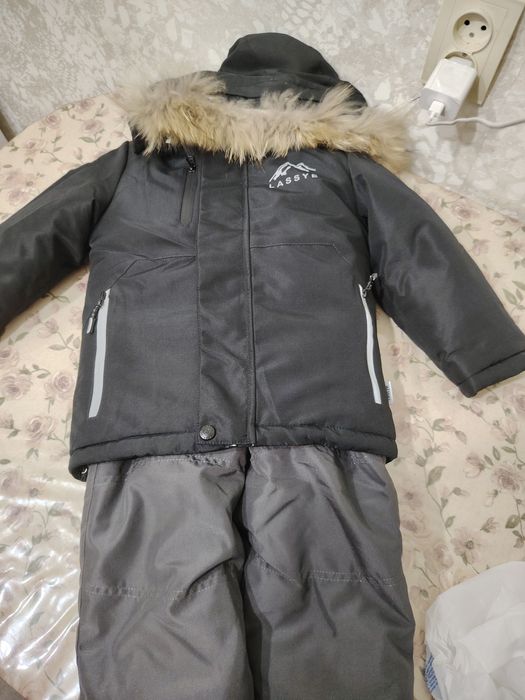 Продам новый  зимний комбинезон