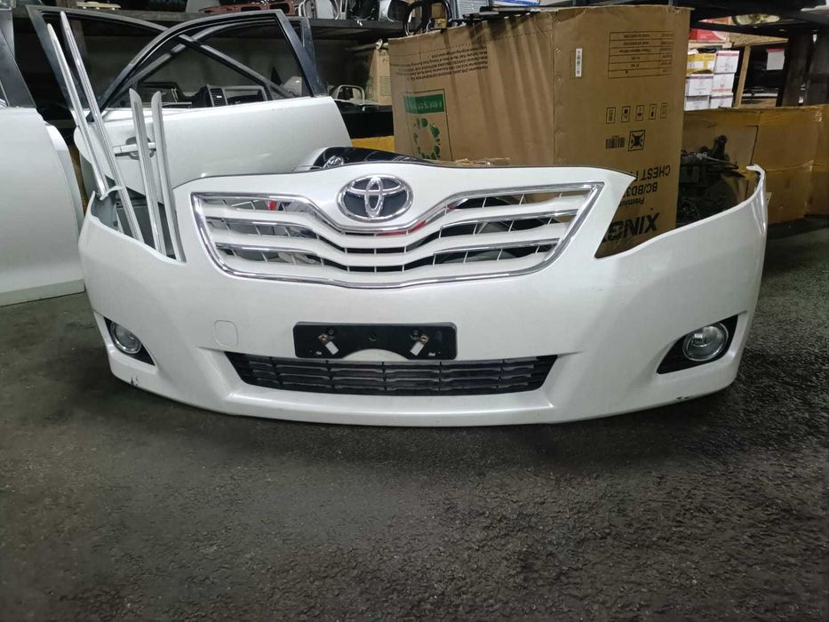 Оригинальный передний бампер Toyota Camry 45