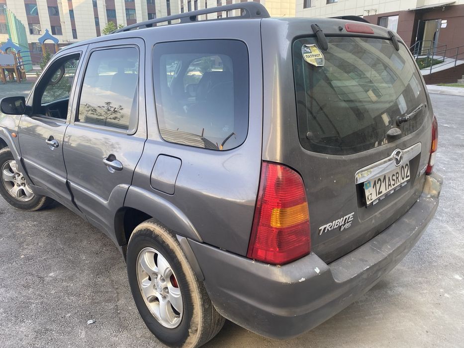 Мазда Трибют