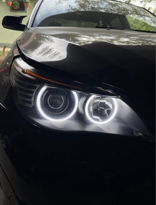 Faruri BMW Seria 5 E60 NFL bi-xenon + Angel Eyes custom