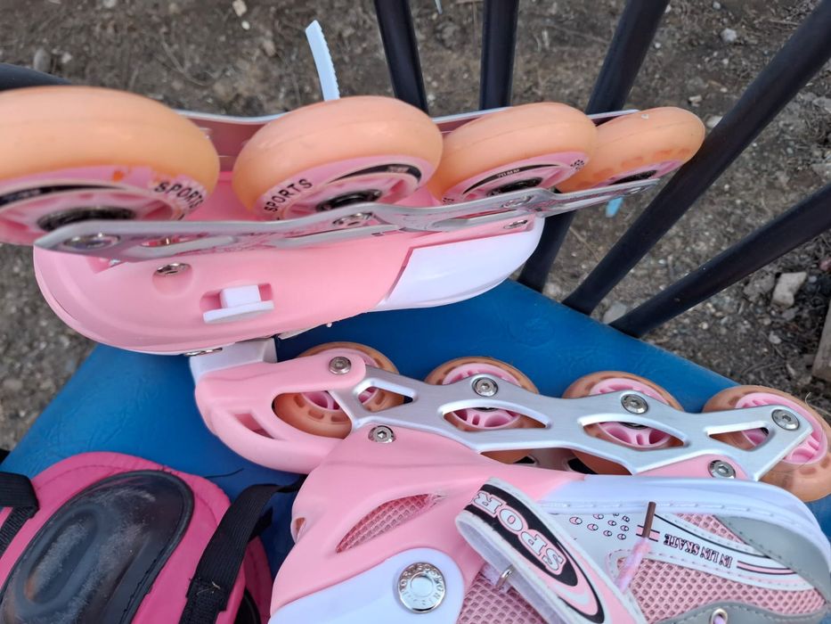 Роликовые коньки