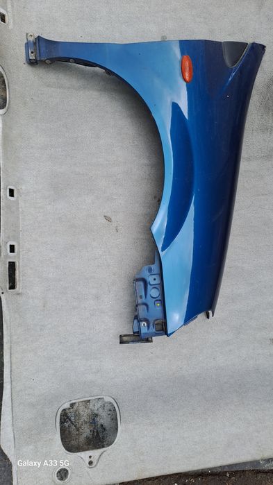 калник Nissan Almera Tino  2000-2006