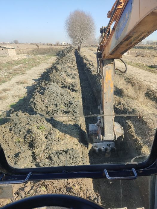 Экскаватор хизмати