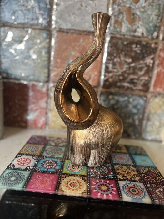 Свeщник нов слон