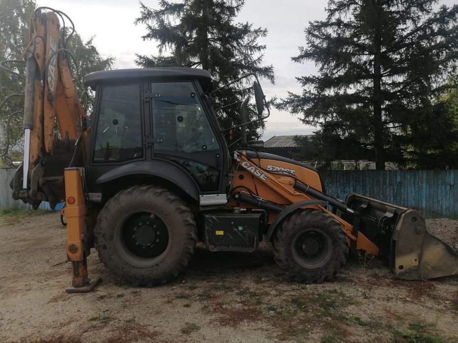 Услуги экскаватора-погрузчика